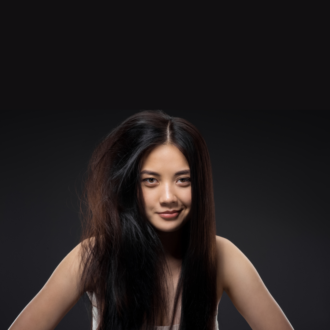 woman with half frizzy hair and the other half straight with no frizz